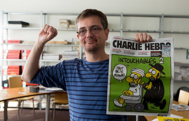648x415_french-satirical-weekly-charlie-hebdo-s-publisher-known-only-as-charb-presents-to-journalists-on